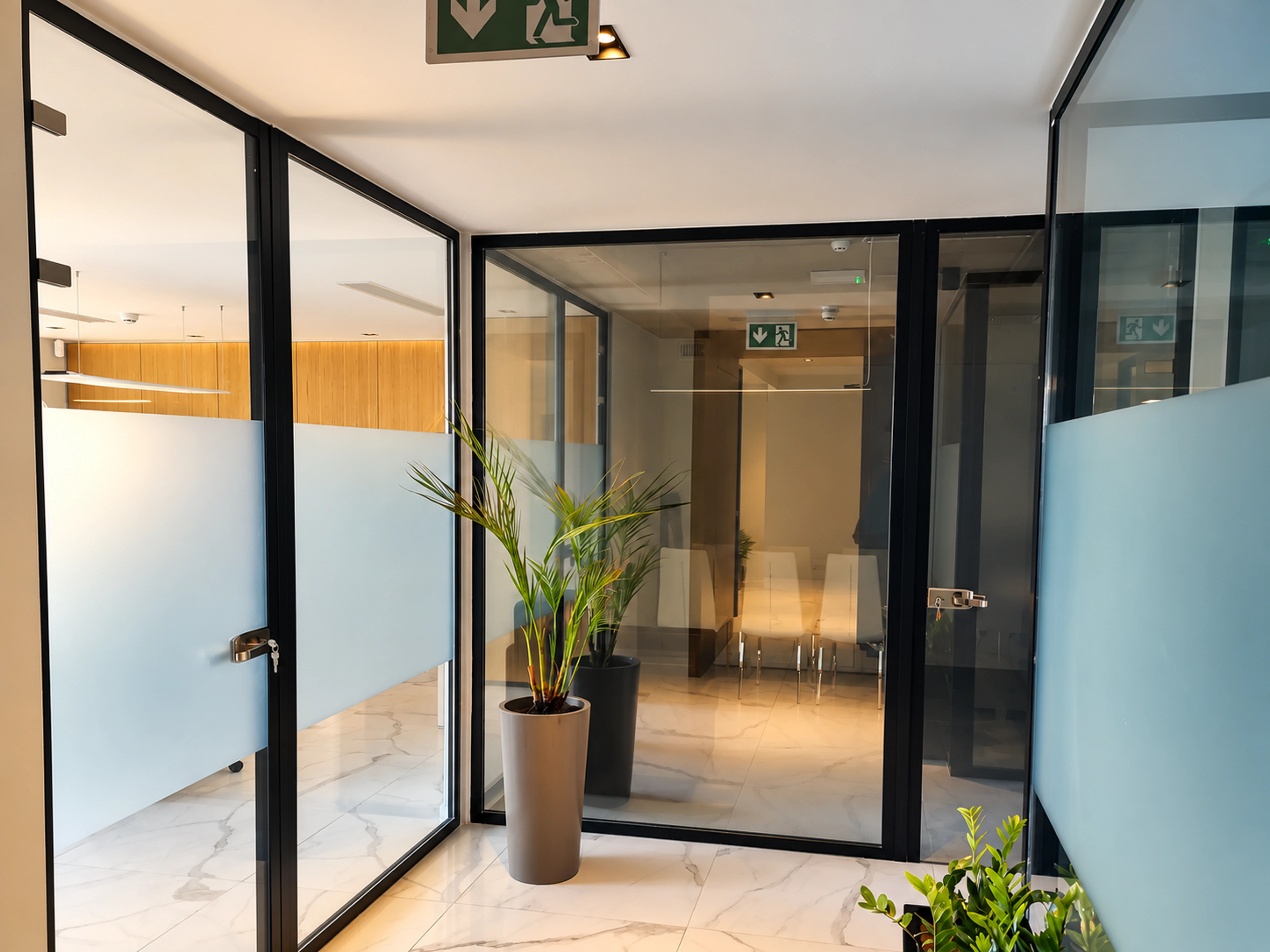 Black-framed glazed office partition corner