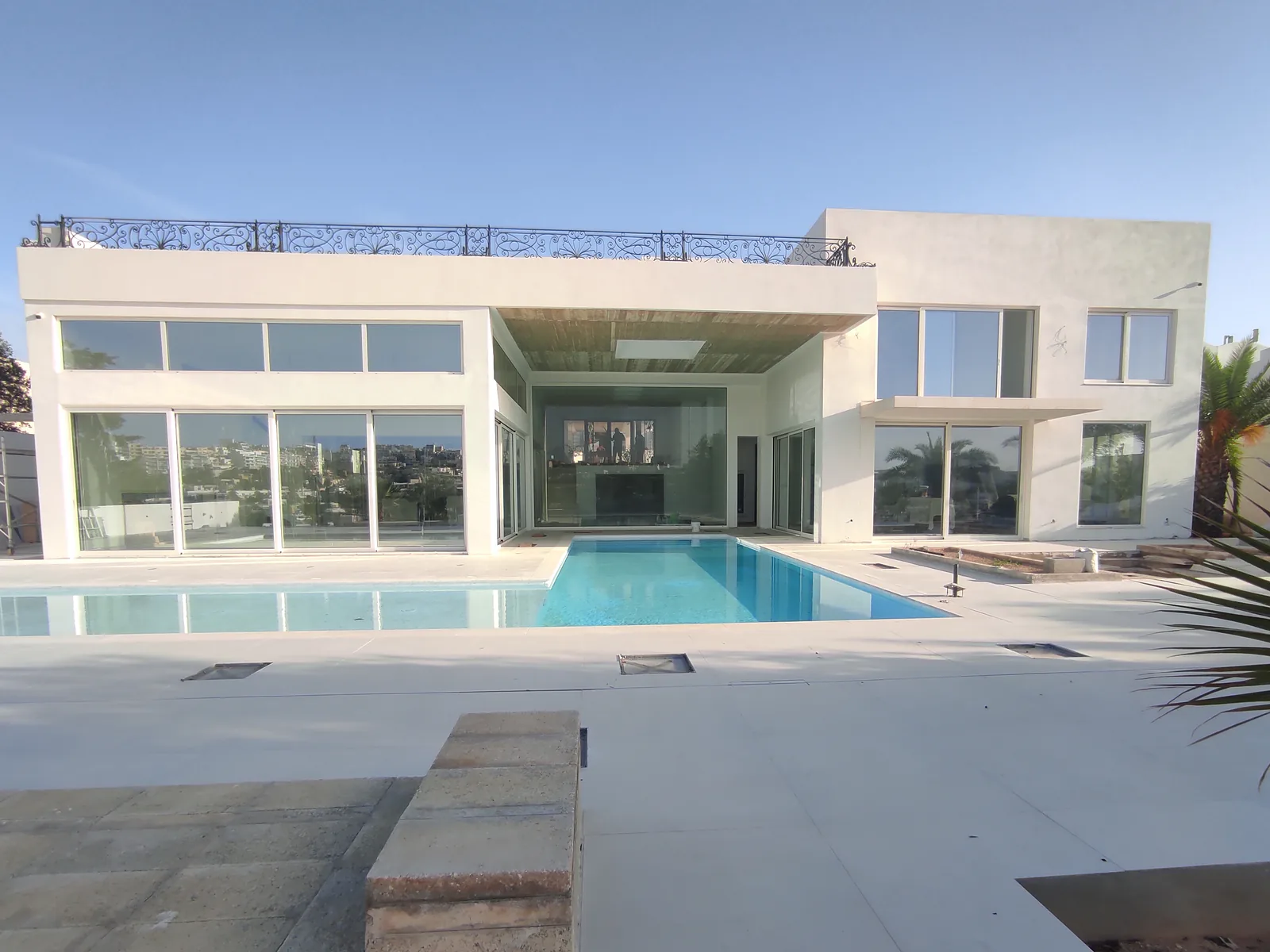 Seafront Villa and pool exterior with custom aluminium sliding doors in Sliema, Malta
