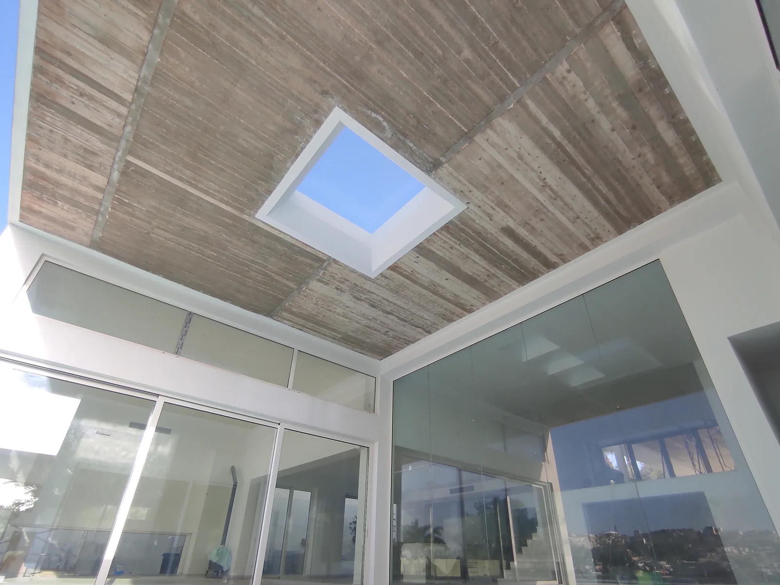 Rooflight and sliding-door threshold detail at Seafront Villa